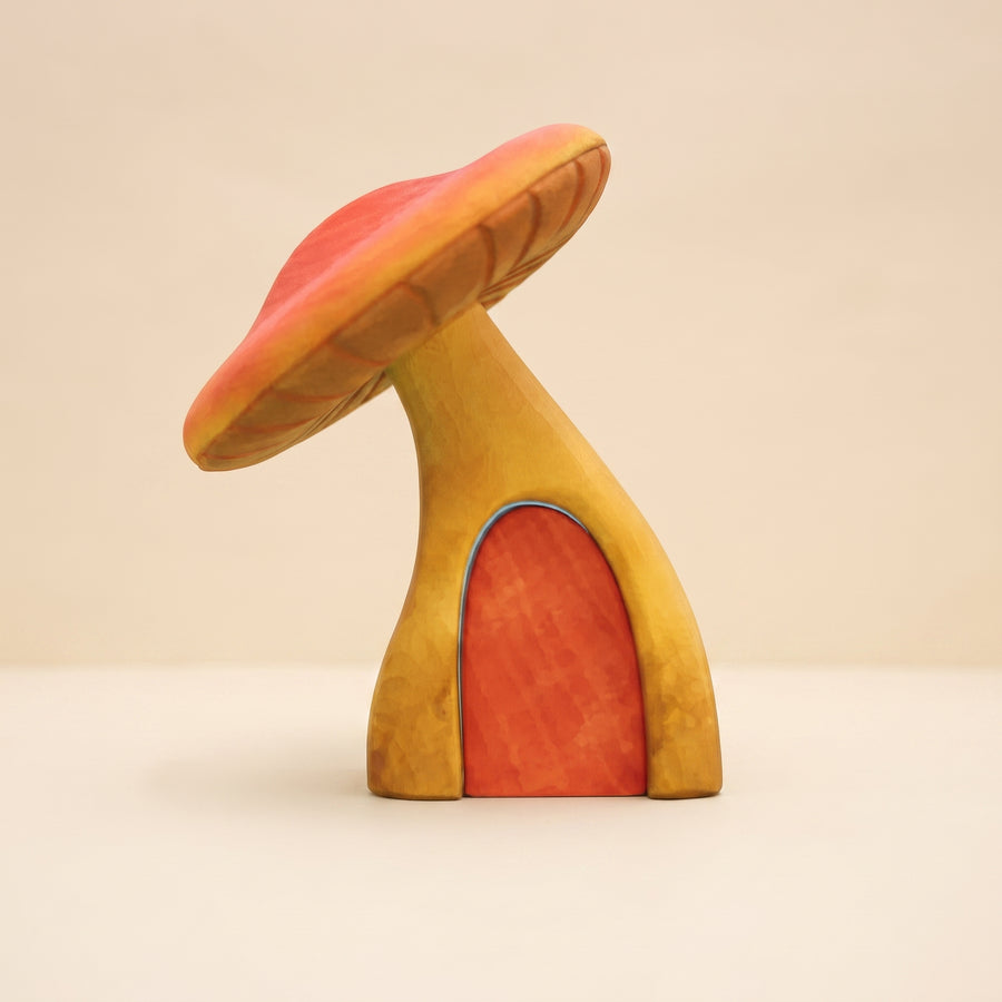 Tall wooden toadstool with a red cap and an arched door cut into the stem