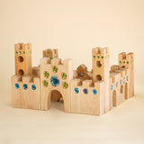 Bauspiel Large Fairytale Castle built from oiled alder towers, gates and walls set with blue and green gems · view 1