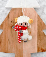 Felt Christmas lamb ornament with golden horns and a red scarf, holding a red and white candy cane · view 1