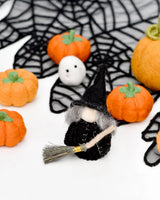 Cloaked felt witch peg doll standing beside other Halloween pieces · view 4