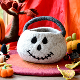 Gray felt trick-or-treat bag shaped as a skull, with a carrying handle · view 1
