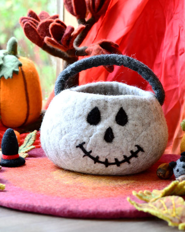 Felt skull bag styled with other Halloween pieces to show how it is used