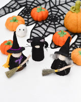 Felt peg doll witch in a pointed hat on a silver birch body, holding a broom · view 1