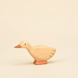 Mako Toys wooden goose with its head lowered, hand-painted in cream with an orange bill · view 1