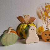 Wooden green pumpkin on a plain background, sized for small hands · view 4