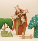 Second view of the wooden windmill showing the sails from an angle · view 2