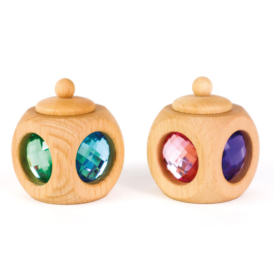 Two Bauspiel Tooth Fairy Boxes in pastel colors with gem windows and twist-top lids