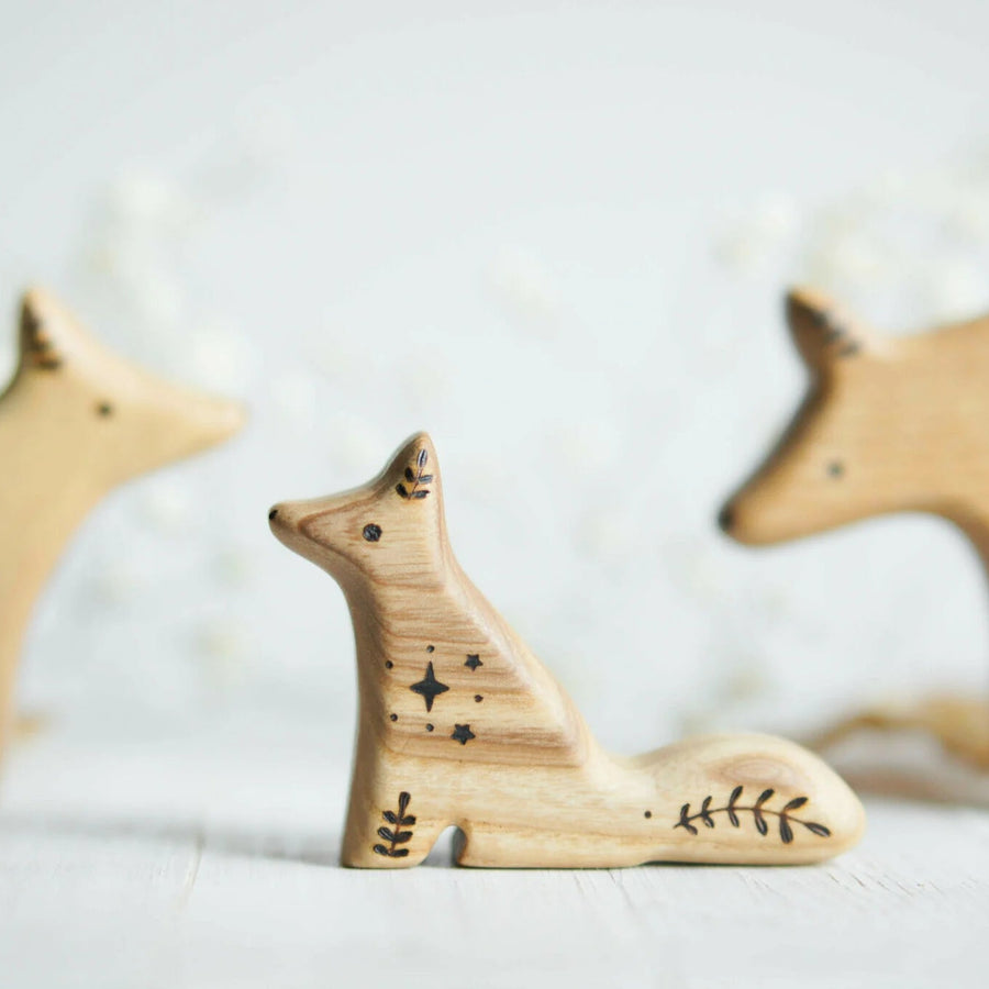 Wooden Baby Wolf, Sitting, a natural wood animal toy by Tiny Fox Hole, cut and finished by hand from solid wood