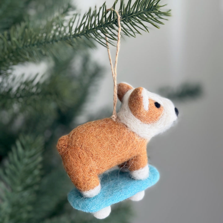 Handmade felt corgi on a skateboard ornament