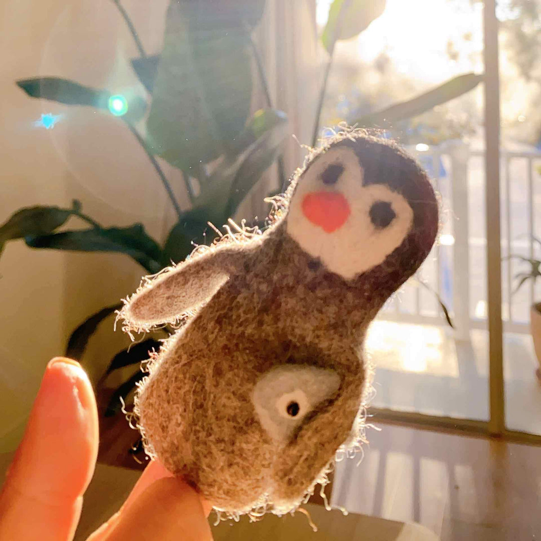 Felt Penguin Carrying A Fish Finger Puppet